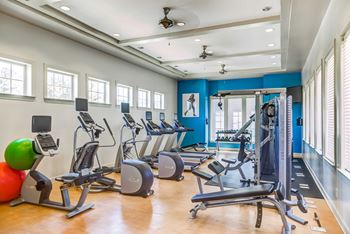 A gym with cardio equipment and weights